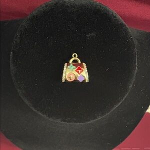 Upcycled and Stamped Charm in Handbag Shape with Colorful Fleur Design.